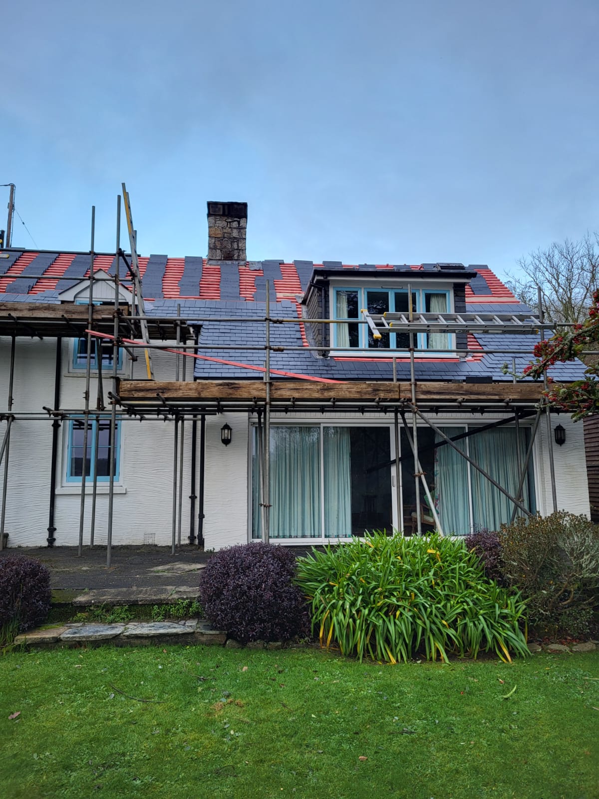 Full re-roof with battens exposed during renovation
